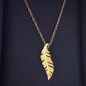 Disney enchanted Pocahontas 14k and 1/10 Diamond Gold Feather Necklace new -tags